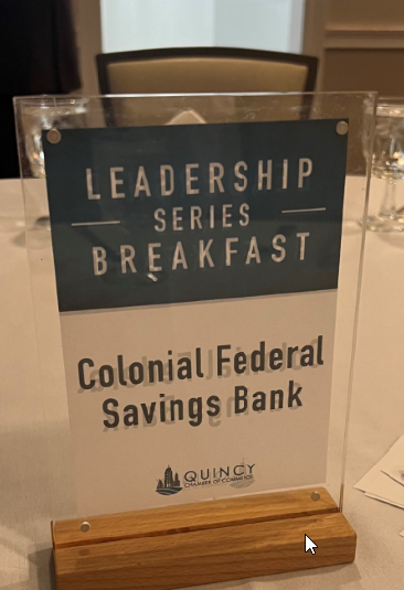 Photo of the Colonial Federal table sponsorship sign at the 10-18-2024 Quincy Chambers breakfast